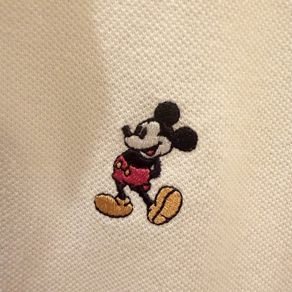 Mickey Mouse Embroidered Logo on white polo.